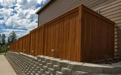Wood privacy fence and ornamental iron installation by Martinez Construction in Bell County TX
